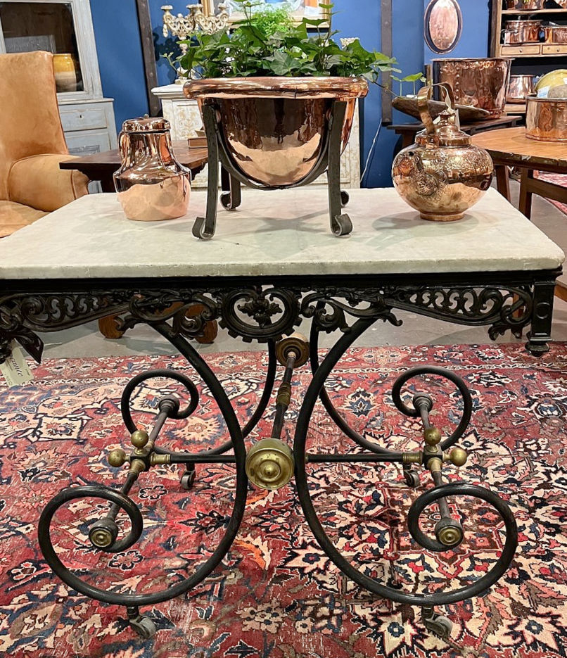 French pastry table with marble top and ornate metal base